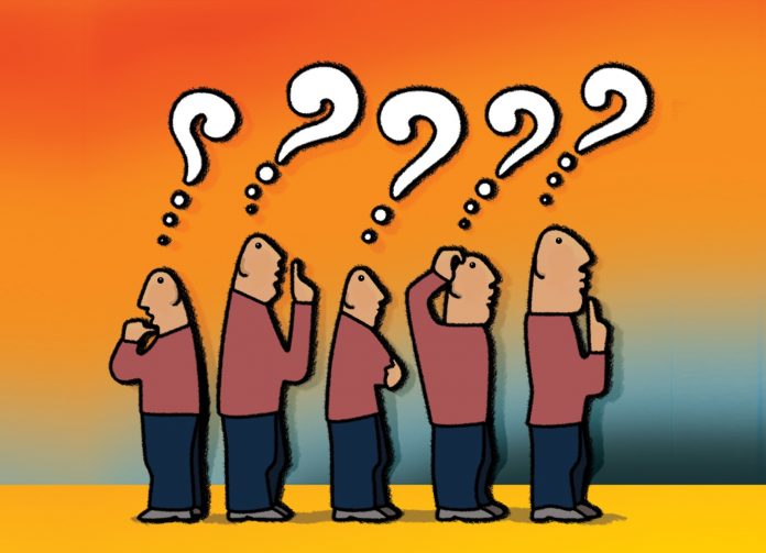 A crowd of men ponder; The crowd of five bald men in thinking with question marks over their heads