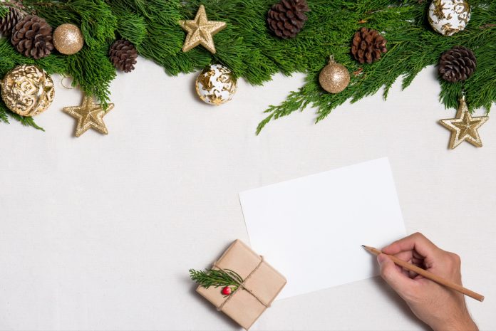 Hand writing letter card on Christmas composition.
