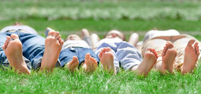 Family feet on grass