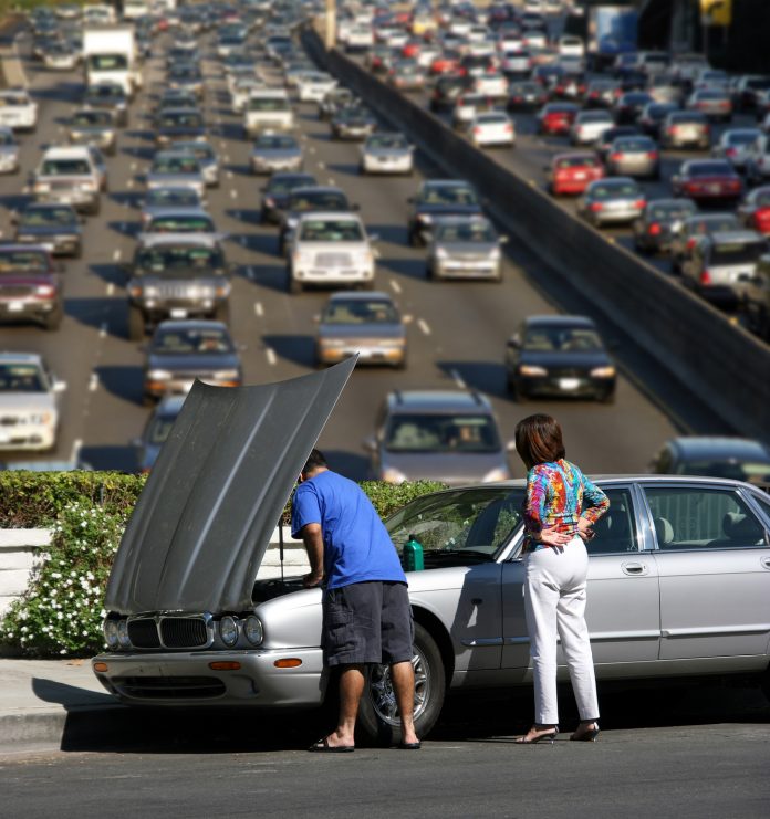 Broken car over California freeway