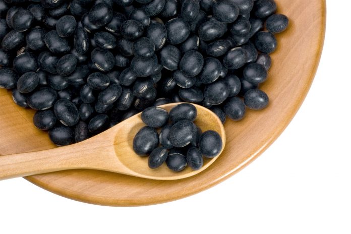 wooden plate with black soy beans