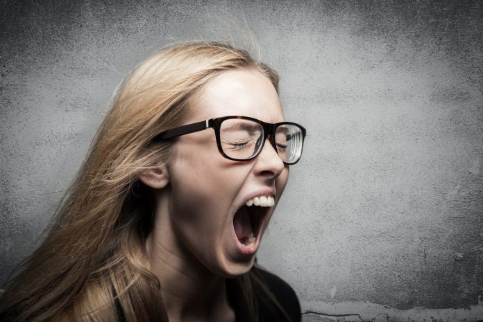 angry young blonde woman