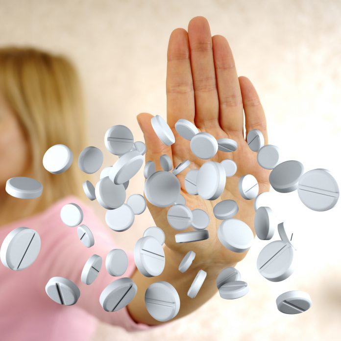 pills and hand