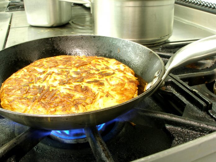 hash brown potatoes are frying