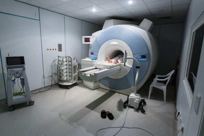 MR scanner in a hospital, with patient being scanned
