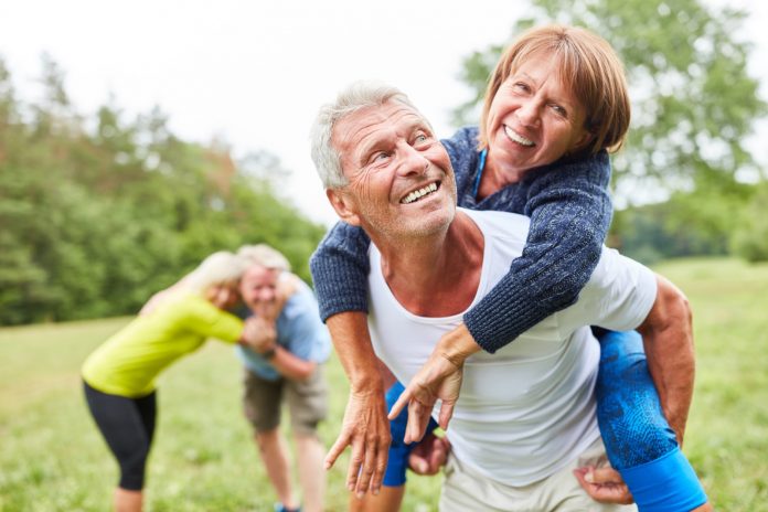 Happy seniors have fun in nature