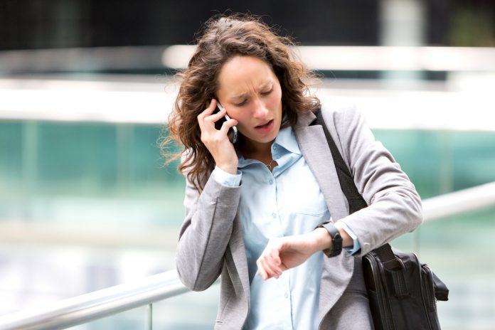 Young attractive woman being late to a rendez-vous