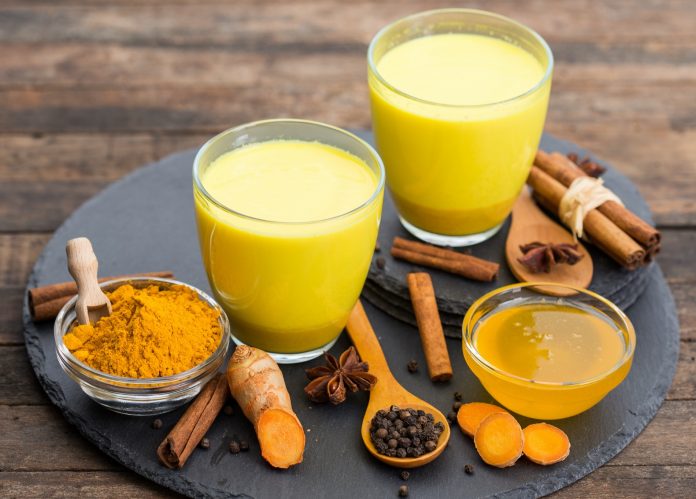 Turmeric golden milk latte with honey and cinnamon