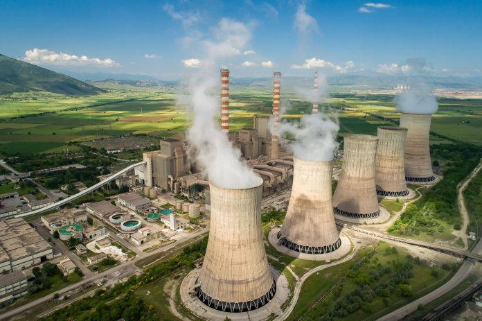 Aerial view the plant producing electrical energy with large pipes at Kozani in northern Greece.