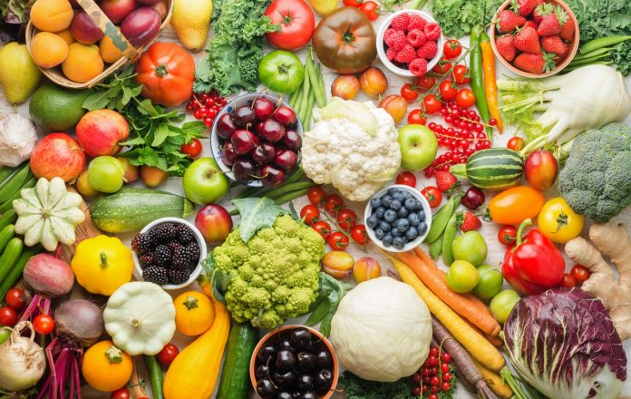 Summer fruits vegetables on table