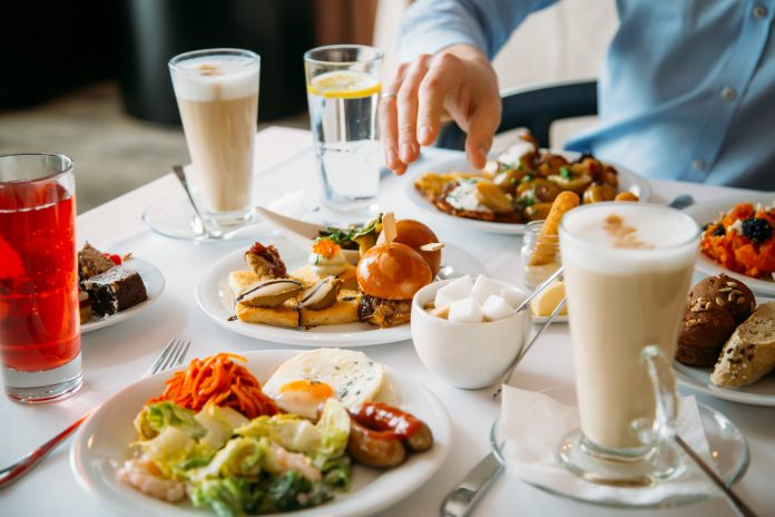 Breakfast Buffet Concept, Breakfast Time in Luxury Hotel, Brunch with Family in Restaurant, Table with Plates of Food for Breakfast - Image