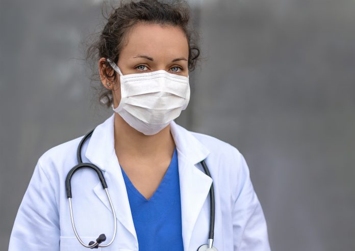 Biology and science. Doctor wearing protection face mask. Virus